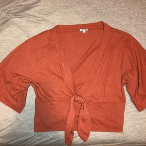 burnt orange deep V neck going out shirt